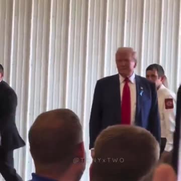 Kamala Harris and Donald Trump walking into the room full of firefighters. What do you notice?