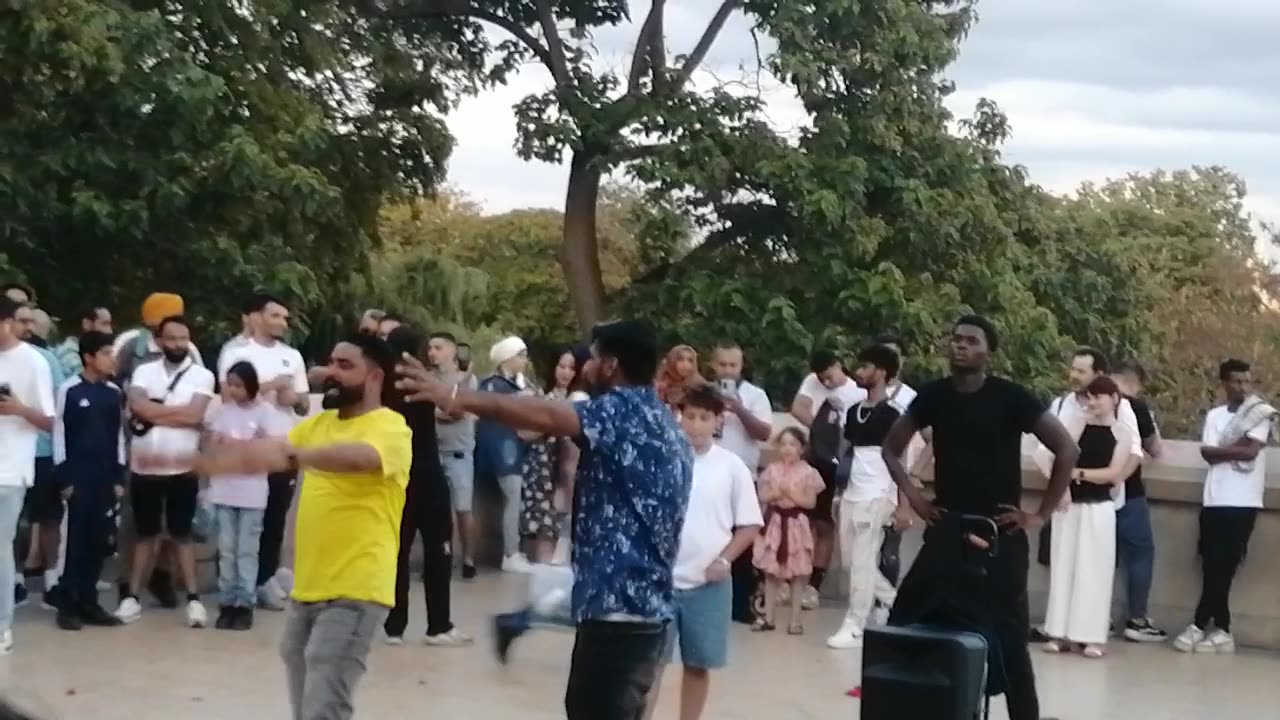 Panjabi boy dancing bihand effal tower Paris France