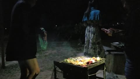 Bbqs with friends with beatiful night out mountain