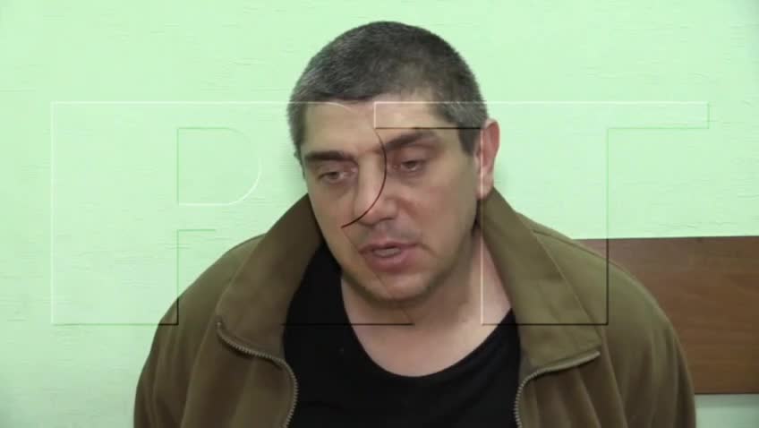 Nazi Ukrainian terrorists during interrogation tell how they killed civilians in Mariupol.