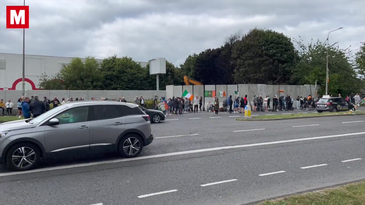 Protesters gather in Coolock a day after scenes of violence from the irish police