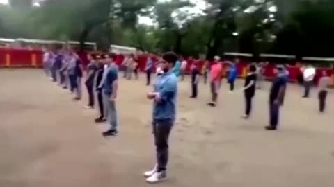 A teacher shows that a bull in a square full of people does not attack if not threatened