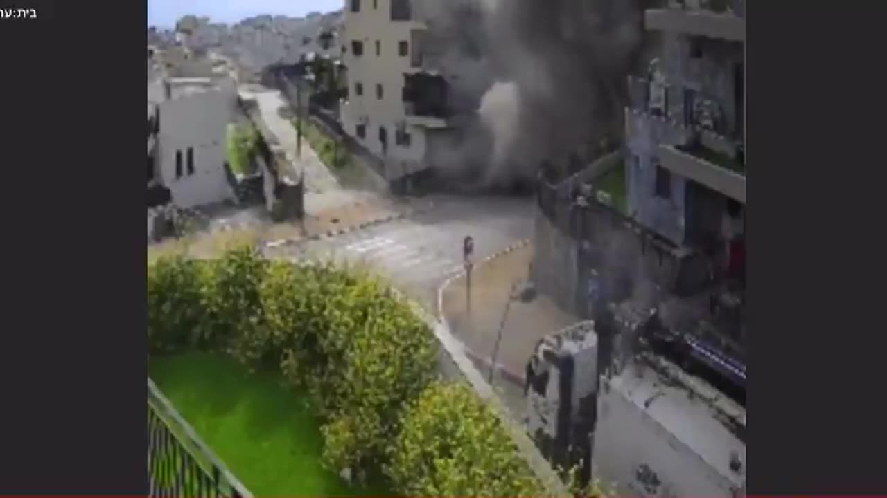 Surveillance camera footage shows one of the rocket impacts in Kiryat Shmona