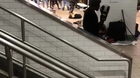 Man boxing punching the air bottom of stairs