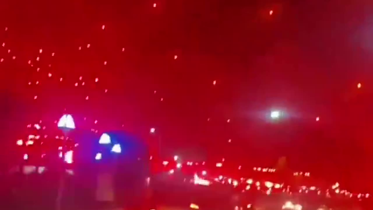 Red flares light the sky as rockets rain down on Israel....