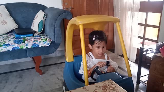 Cute Little girl enjoying with kids car