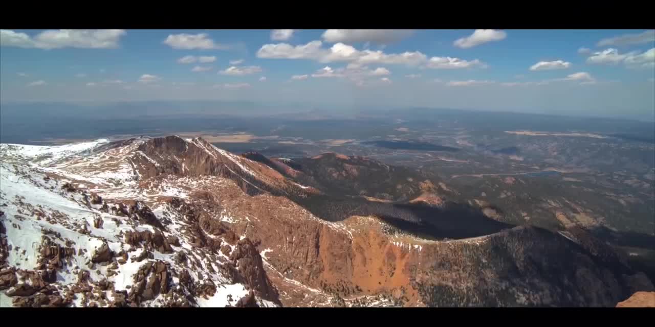 towering mountains with visible clouds