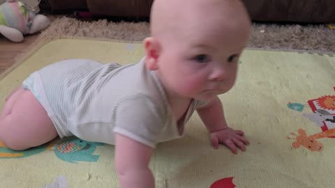 Little baby roman o'c learning to crawl