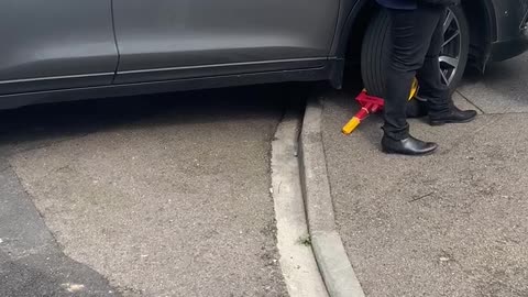 Disabled Man Clamps Car Parked on the Curb