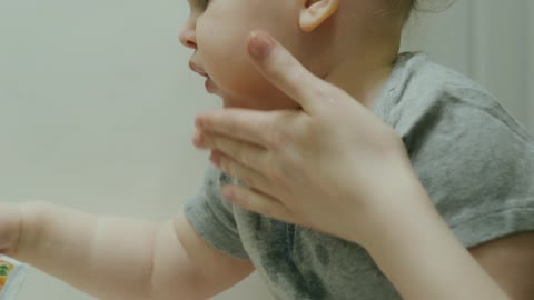 Messy baby adorably gets mini bath after meal time