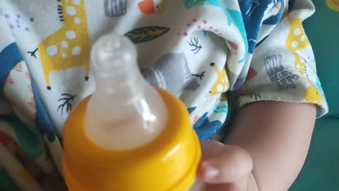 funny video of a 3 month old baby trying to drink milk