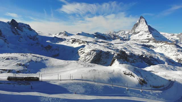 Train Transporting Public Above The Mountains Alps Of Switzerland