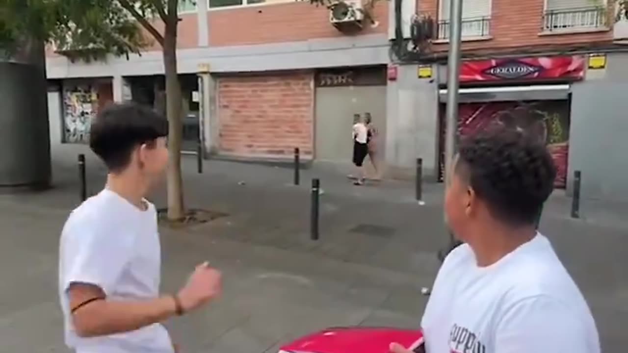 Foreign children throw prank balloons at innocent Spanish girls walking on the