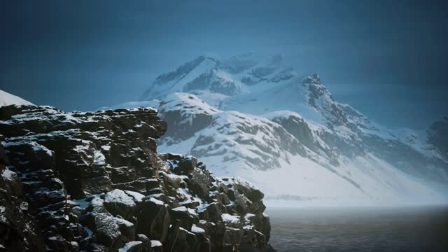 snow covered mountains in northern ocean