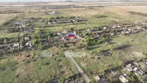 Russian flag raised in the center of Vodyanoye.
