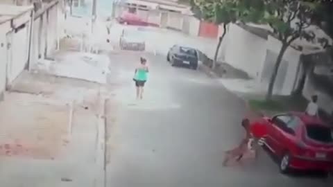 man fights with dog to save child