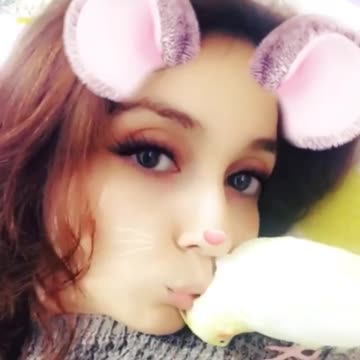 girl playing with her Bird