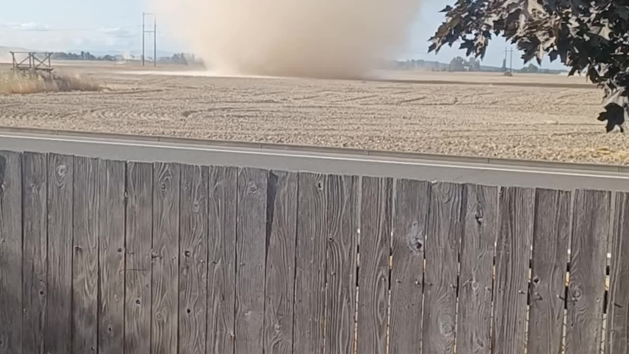 Large And Silent Dust Devil Sweeps Across Backyard