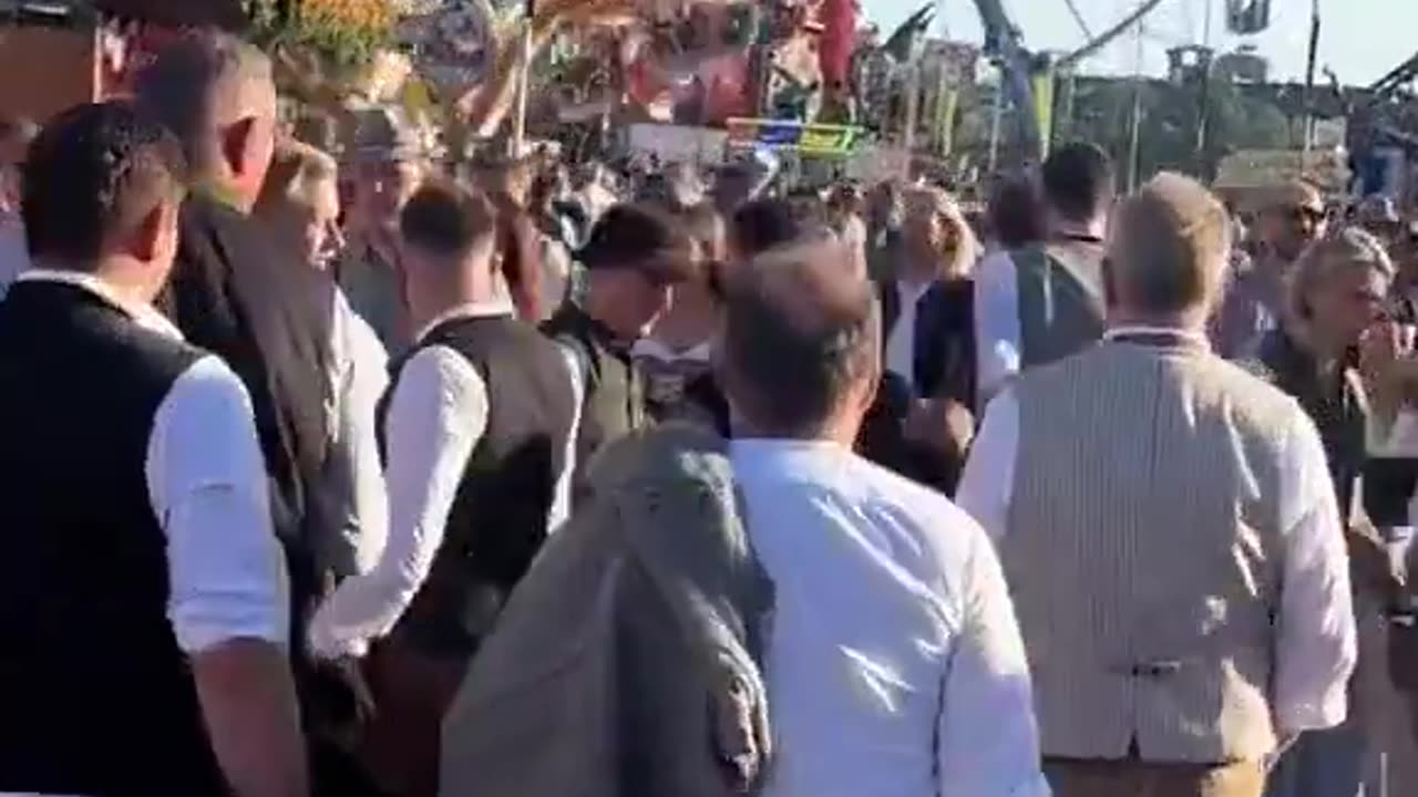 A migrant walks through Oktoberfest in Germany groping random women and