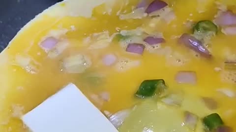 Placing Cheese over Omelette