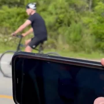 Biden Rolls By On A Bicycle While Press Shouts About Credit Downgrade