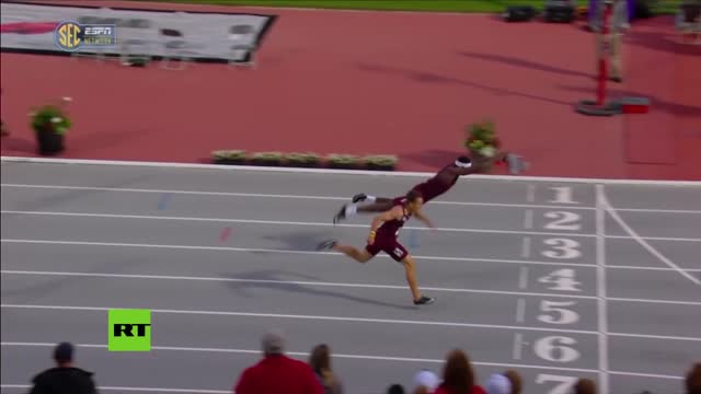 'superman dive' at finish line gives 400m hurdler dramatic victory