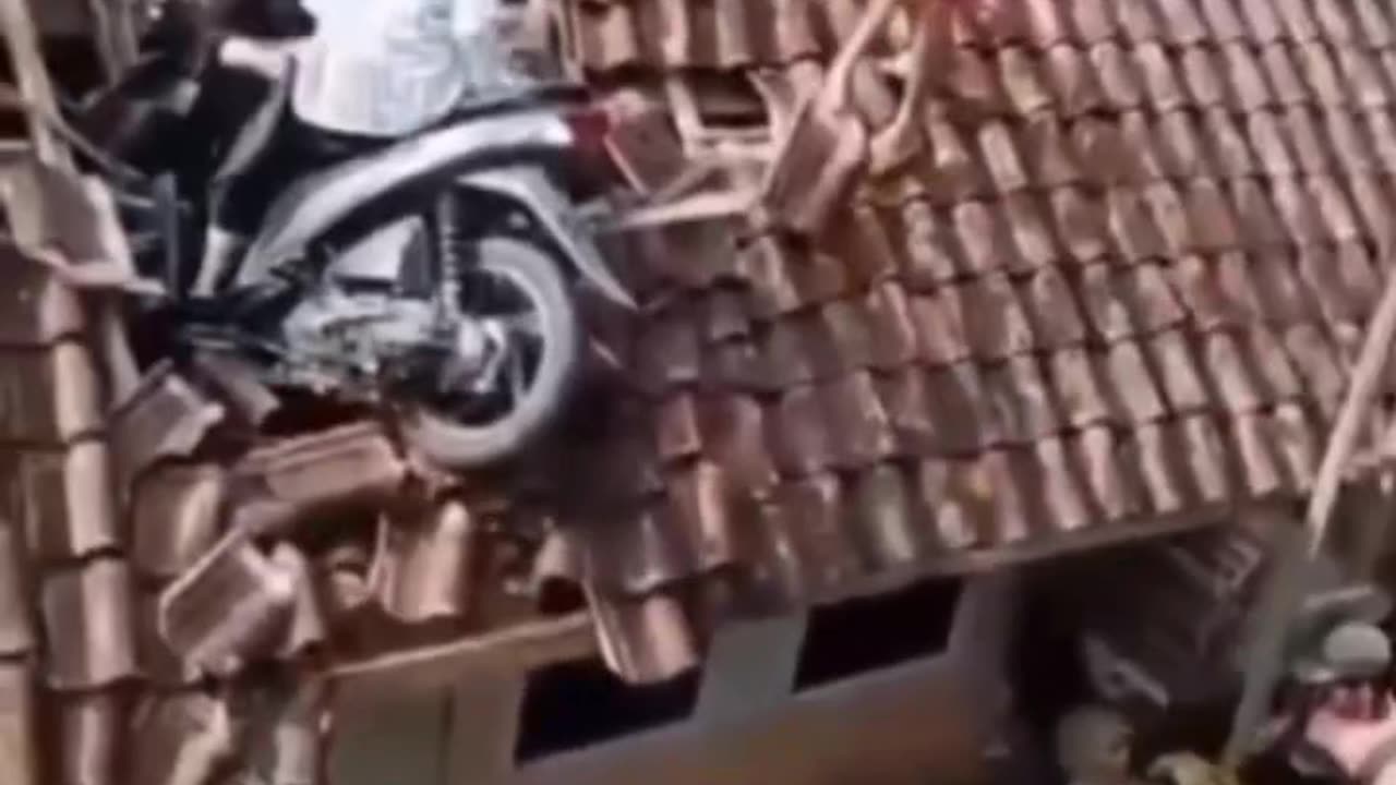 It's a rare incident... how come a motorbike can climb onto the roof of a house