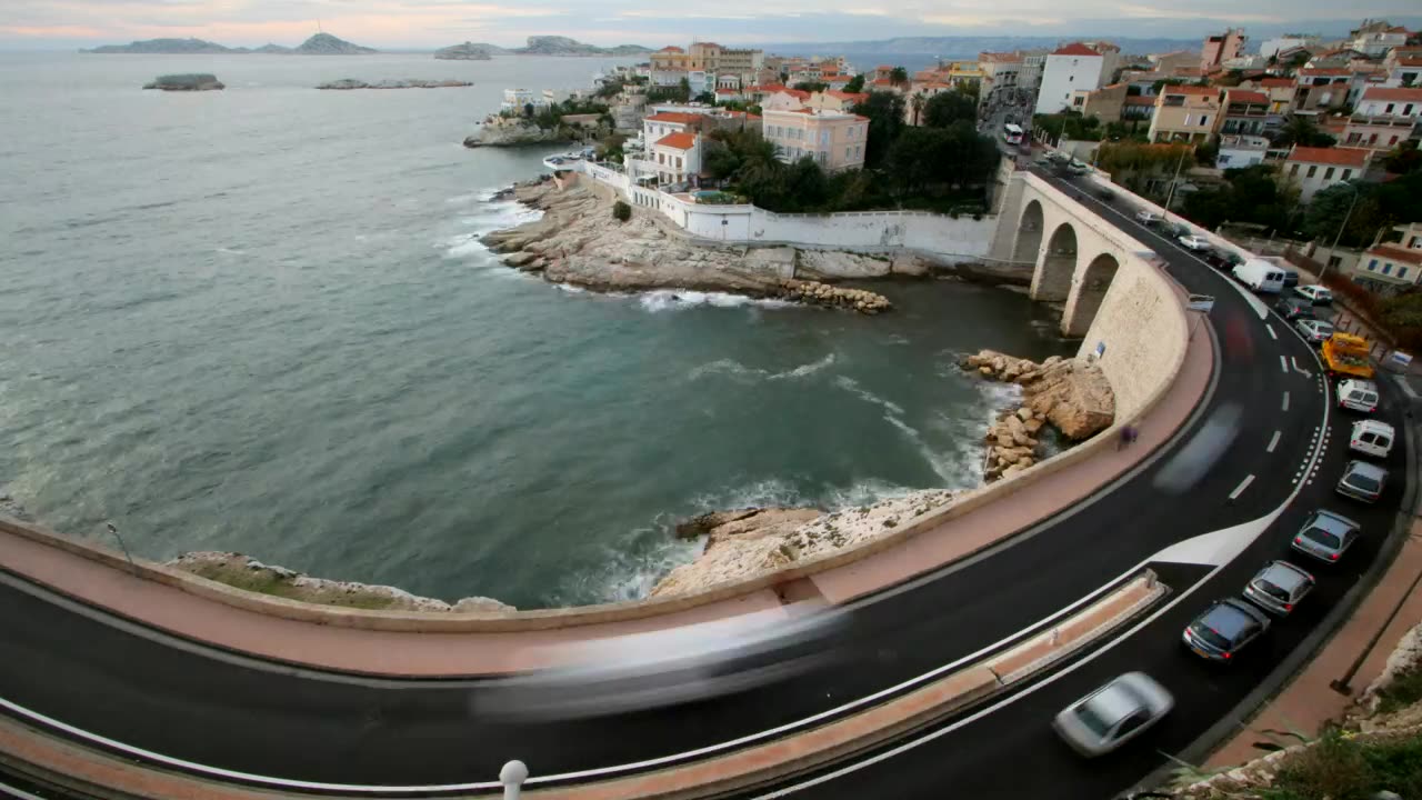 Time lapse of the coast with a street with traffic