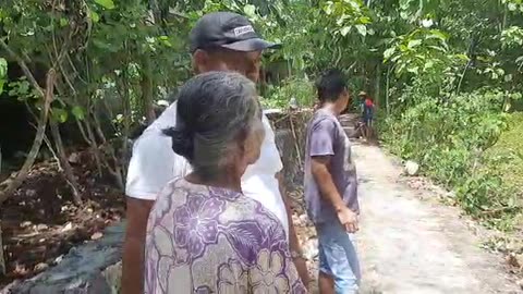 handing over the land to be donated to the residents and witnessed directly by the village head