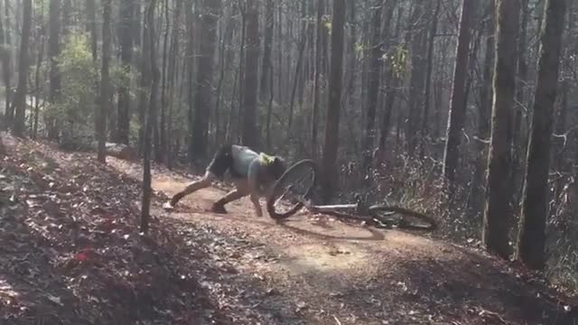 Green shirt long hair dirt bike fall