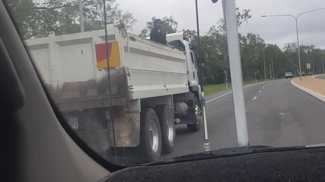 Police Ride Unsecured in Back of Utility Truck