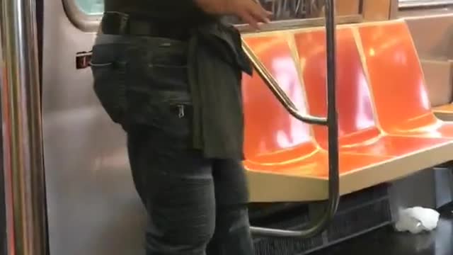Man grey shirt dancing on train