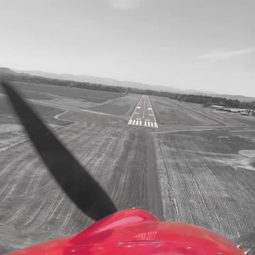 landing in black and white... and red
