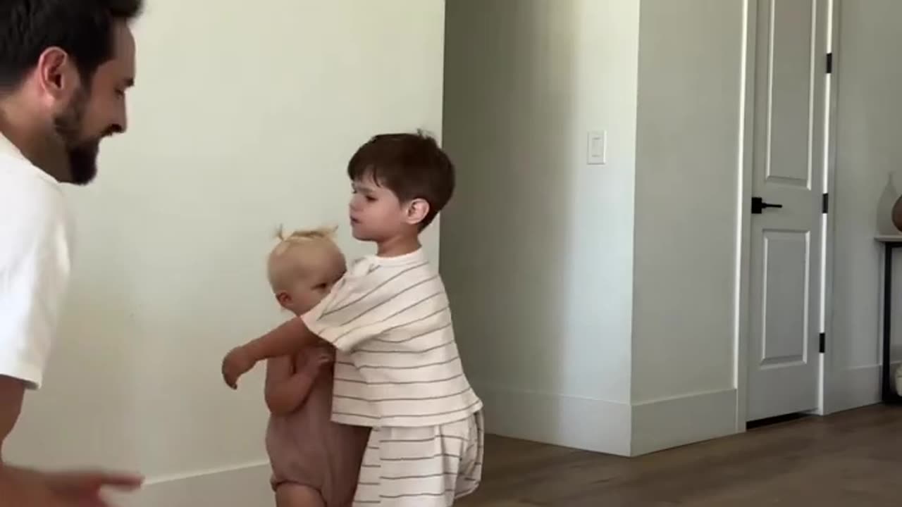 "Toddler Tug-of-War: A Heartwarming Tale of Choosing Between Dad and Big Brother!"