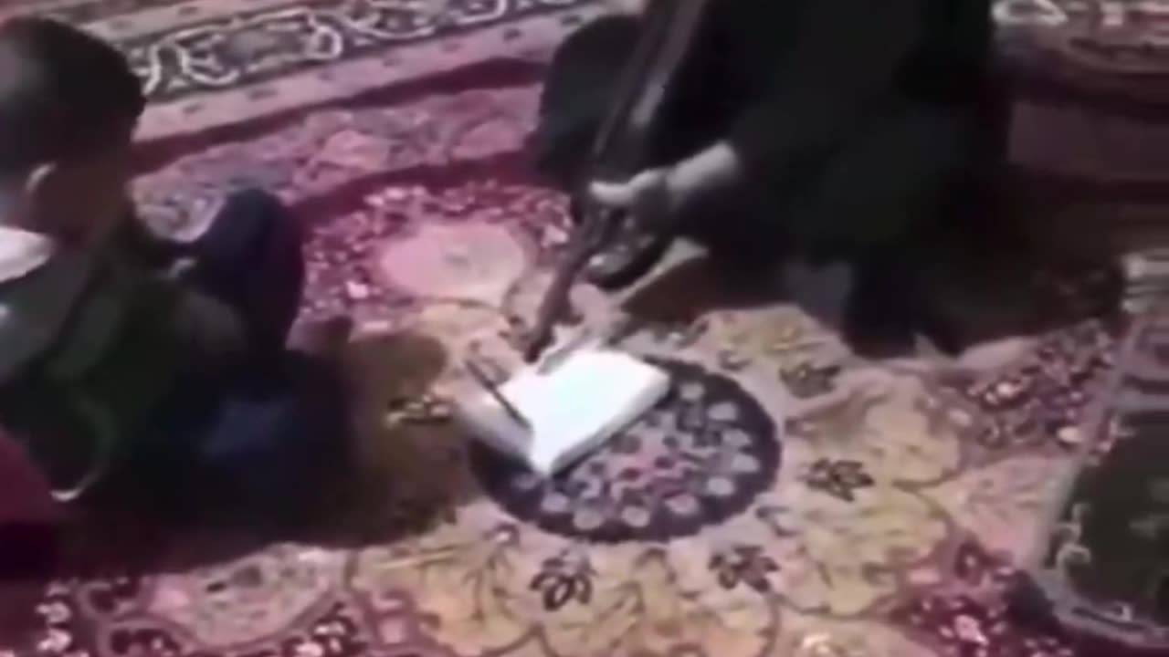 Muslim father threatens son with rifle to memorize Quran