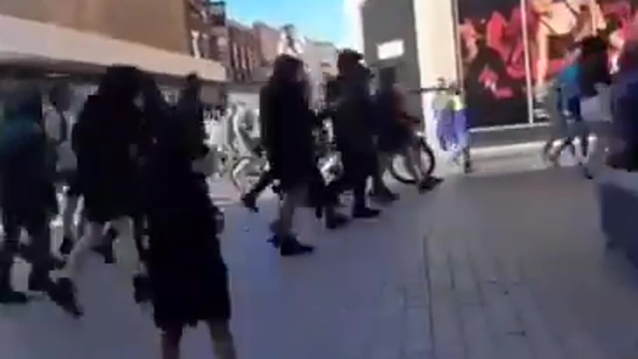 An Islamic stand handing out Koran in Liverpool was swept away by British