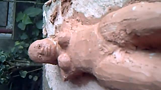 UNFINISHED sculpture on clay