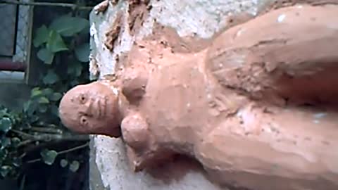 UNFINISHED sculpture on clay