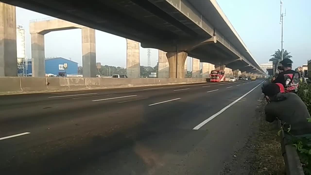 Buses pass by on the Jakarta Indonesia toll road