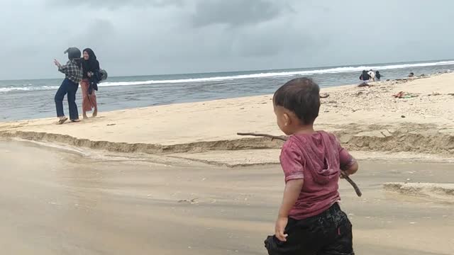 the joy of a child playing on the beach