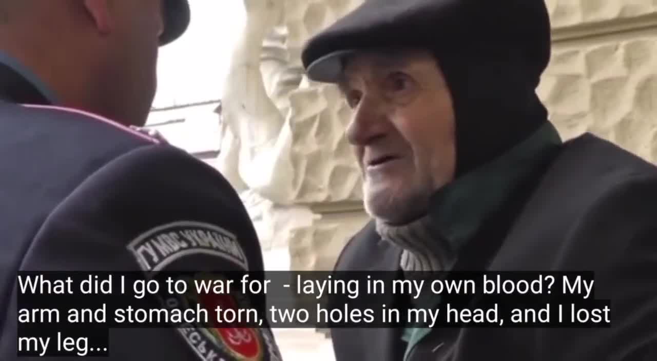 Ukraine. Odessa. A policeman forces a veteran to leave the city square