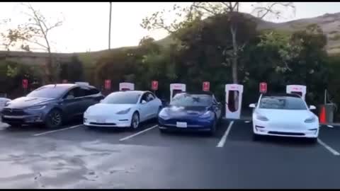 EV line to charge cars, looks worse than gas stations.