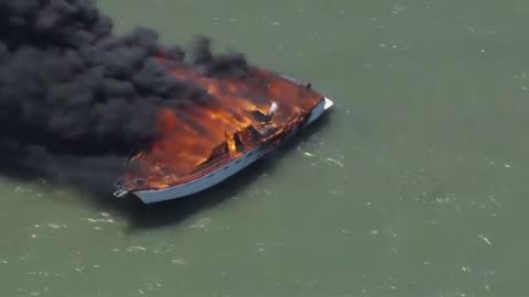 Boat catches fire in the waters in San Francisco Bay in California, off Redwood City