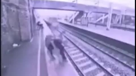 😇 Angel 😇 Stranger Saves Man From Jumping In Front of Speeding Train. Caught On Camera