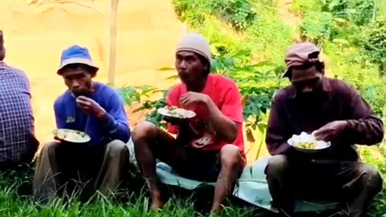 eating with friends on the edge of the rice fields