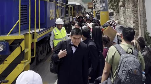 Woman Saved From Stepping In Front Of Moving Train