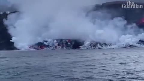 Steaming pyramid of rock emerges from the sea off La Palma as lava reaches the s