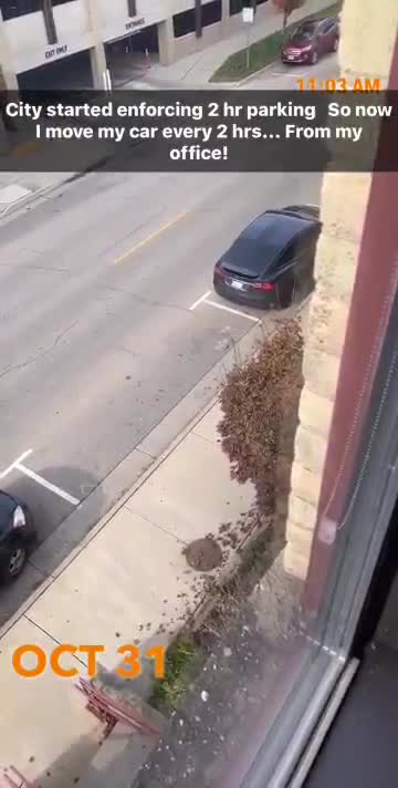 Man moves his car from office window