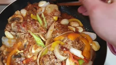 Hamburger steak mixed with homemade sauce Mushroom, parsley, onion, whole garlic, garlic