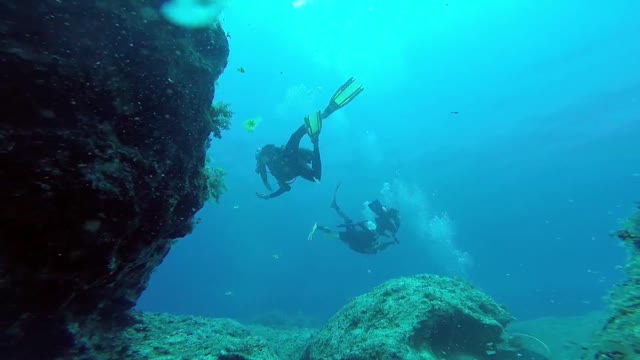 Divers under the cave